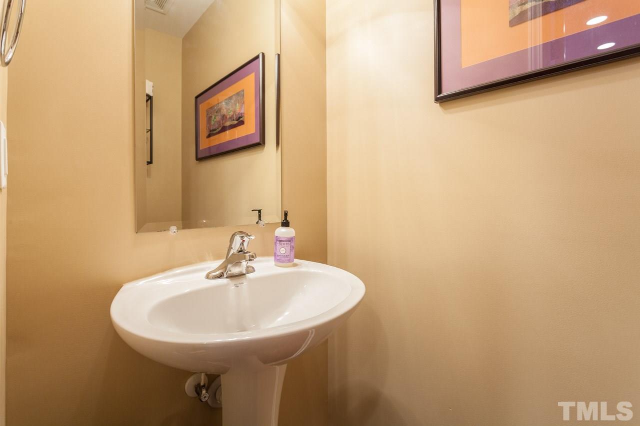 2930 Casona Way Raleigh, NC 27616 - Photo 9 of 25 a bathroom with a sink and a mirror