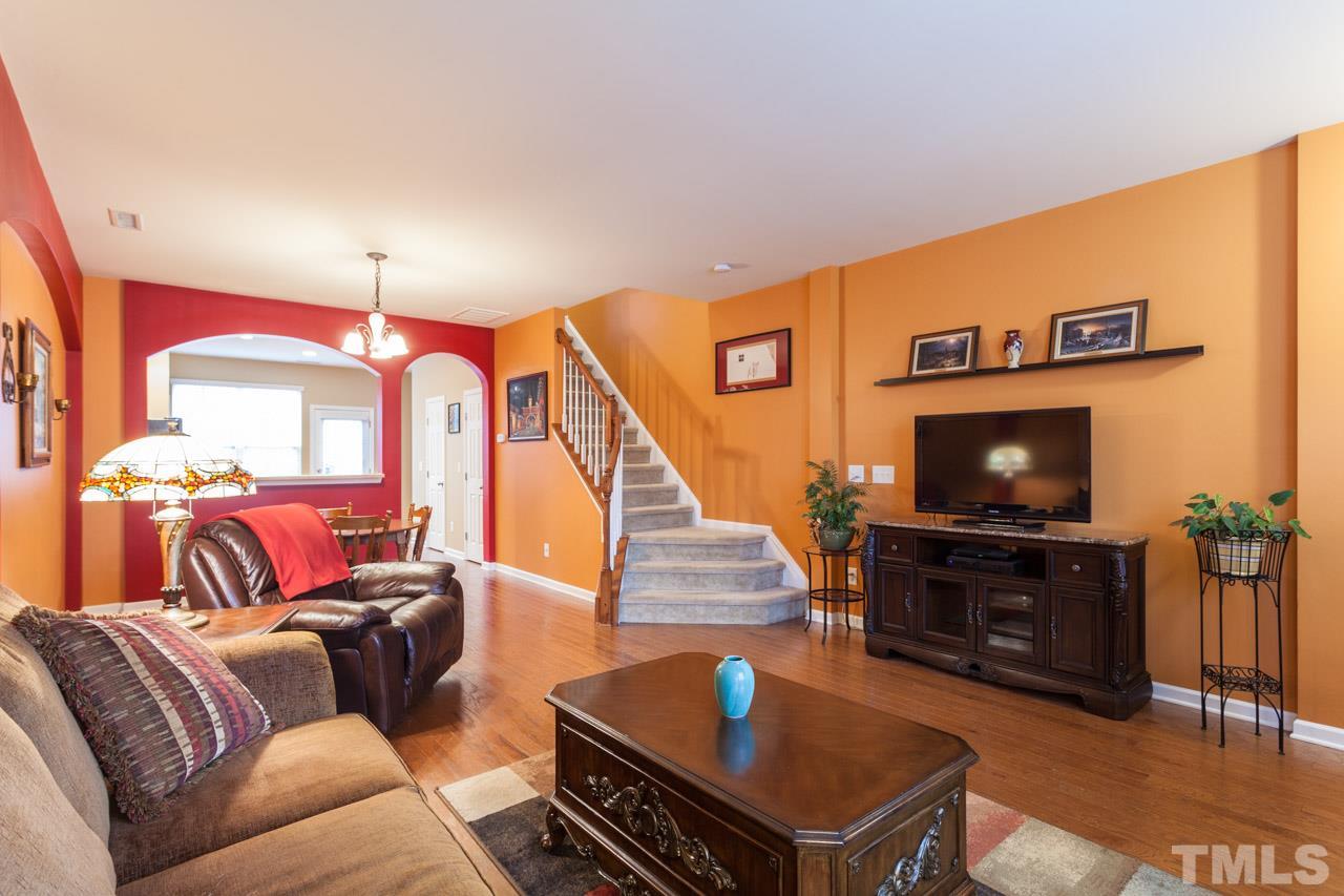 2930 Casona Way Raleigh, NC 27616 - Photo 10 of 25 a living room with furniture and a flat screen tv
