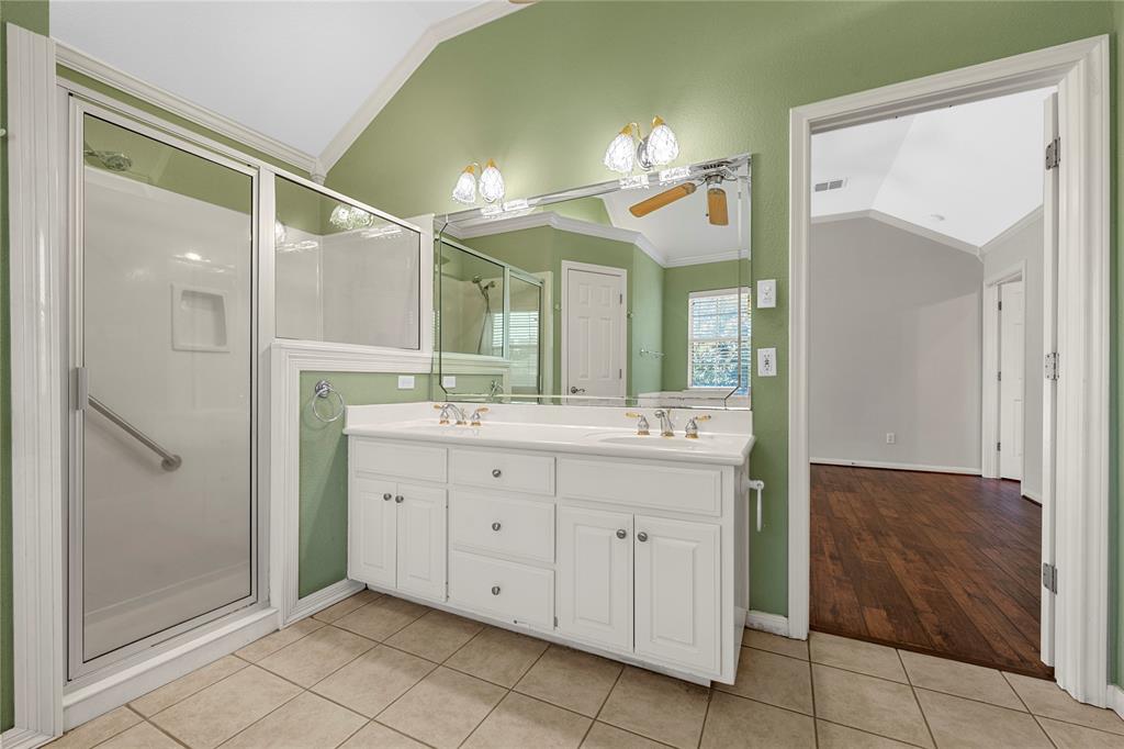 1209 Stonehill Circle Hewitt, TX 76643 - Photo 12 of 24 a spacious bathroom with a mirror sink and shower