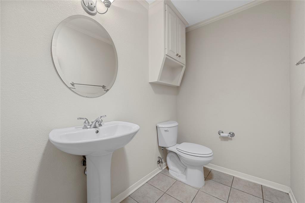1209 Stonehill Circle Hewitt, TX 76643 - Photo 16 of 24 a bathroom with a sink a toilet and a mirror