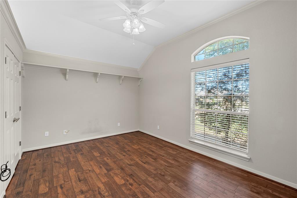 1209 Stonehill Circle Hewitt, TX 76643 - Photo 17 of 24 wooden floor in an empty room with a window