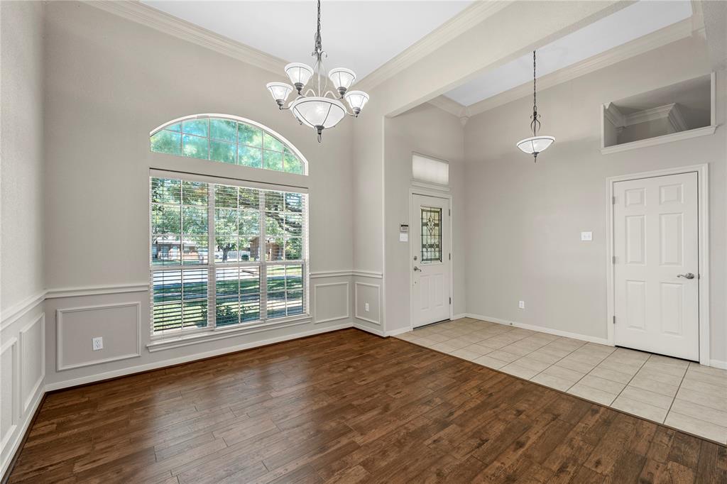 1209 Stonehill Circle Hewitt, TX 76643 - Photo 2 of 24 an empty room with wooden floor chandelier and windows