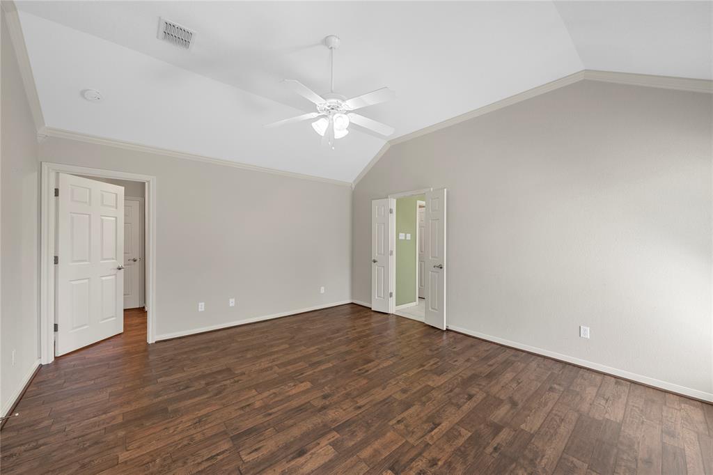 1209 Stonehill Circle Hewitt, TX 76643 - Photo 9 of 24 an empty room with wooden floor and ceiling fan