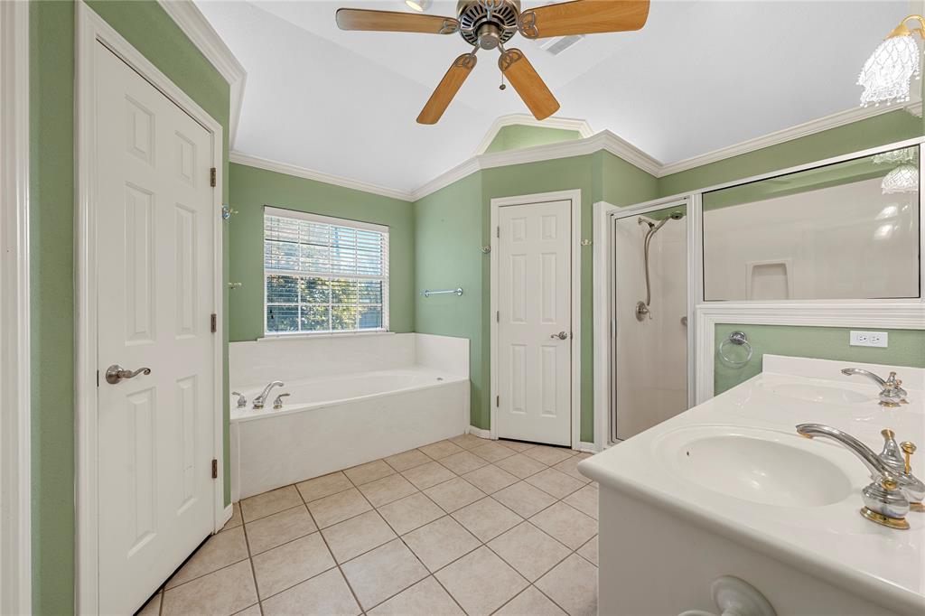 1209 Stonehill Circle Hewitt, TX 76643 - Photo 10 of 24 a bathroom with a sink a bath tub and a shower