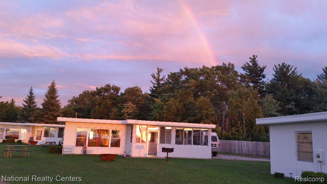6024 Port Austin Road, Unit 5 Caseville, MI 48725 - Photo 3 of 56 Looking from beach at the rainbow over cottage