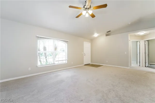 a view of an empty room with a window