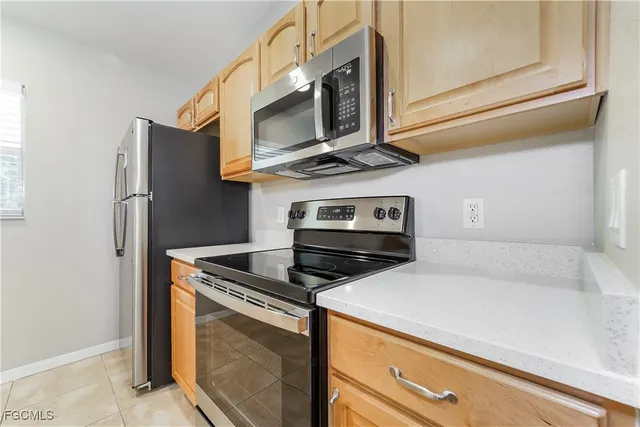 a kitchen with a stove and a microwave