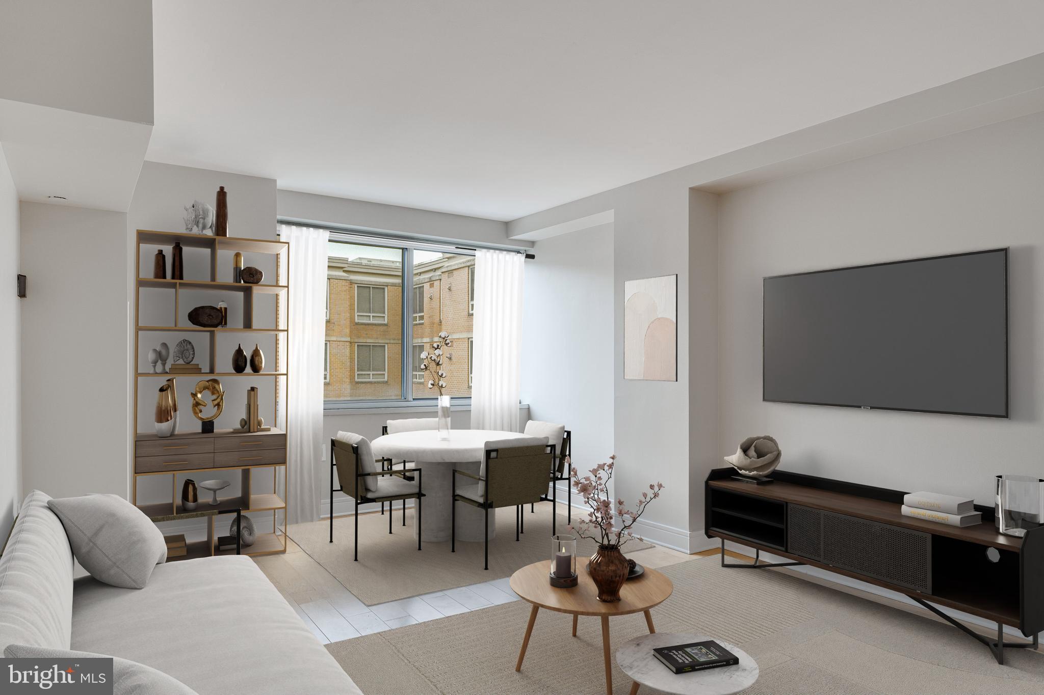 800 4th Street Southwest, Unit S418 Washington, DC 20024 - Photo 7 of 22 a living room with furniture and a flat screen tv