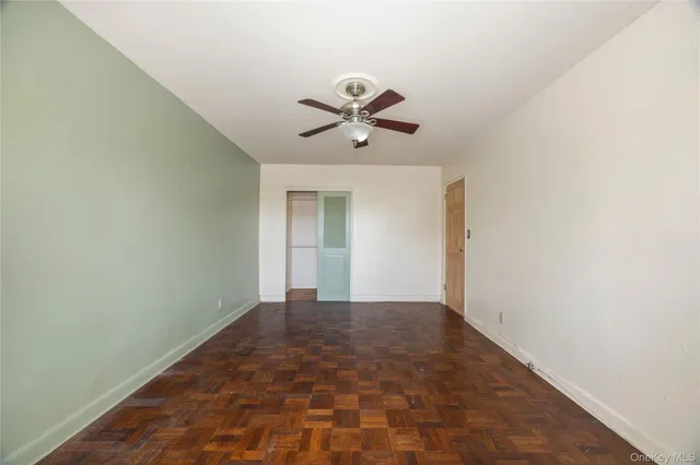a view of a chandelier fan in a room