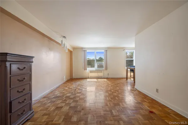 a view of an empty room with a window