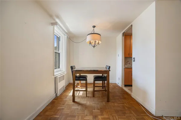 a view of a dining room with furniture and window