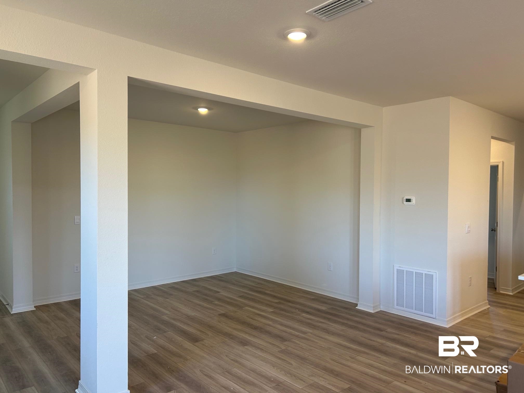 18127 Kent Circle Foley, AL 36535 - Photo 4 of 8 Spare room with dark wood-type flooring and baseboards