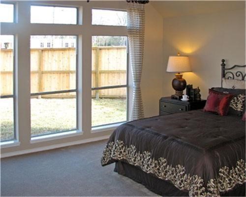 1602 Eden Meadows Drive Spring, TX 77386 - Photo 13 of 25 a bedroom with a bed and a window