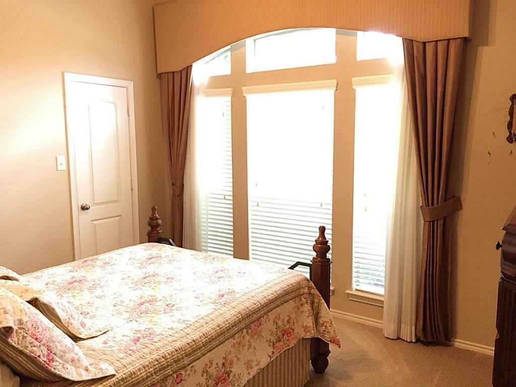 1602 Eden Meadows Drive Spring, TX 77386 - Photo 17 of 25 a bedroom with a bed and a window