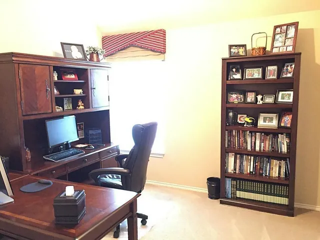 a view of a workspace with furniture
