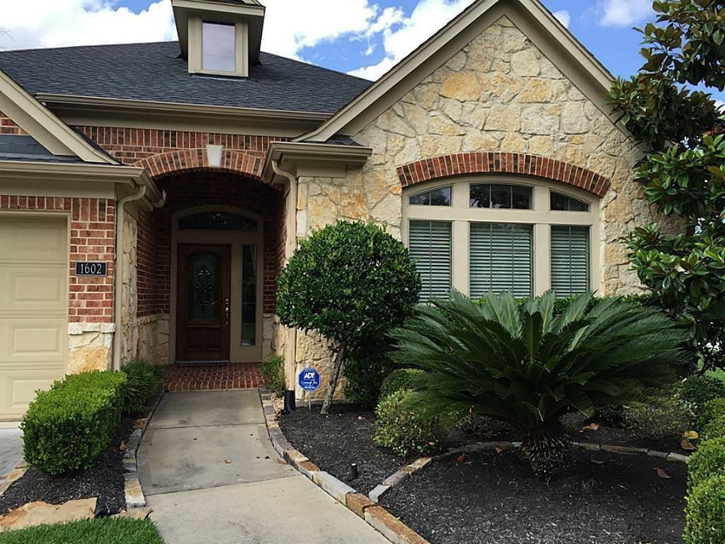 1602 Eden Meadows Drive Spring, TX 77386 - Photo 2 of 25 a front view of a house with garden