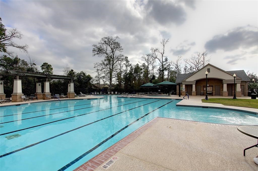 1602 Eden Meadows Drive Spring, TX 77386 - Photo 23 of 25 a view of house with garden and tall trees