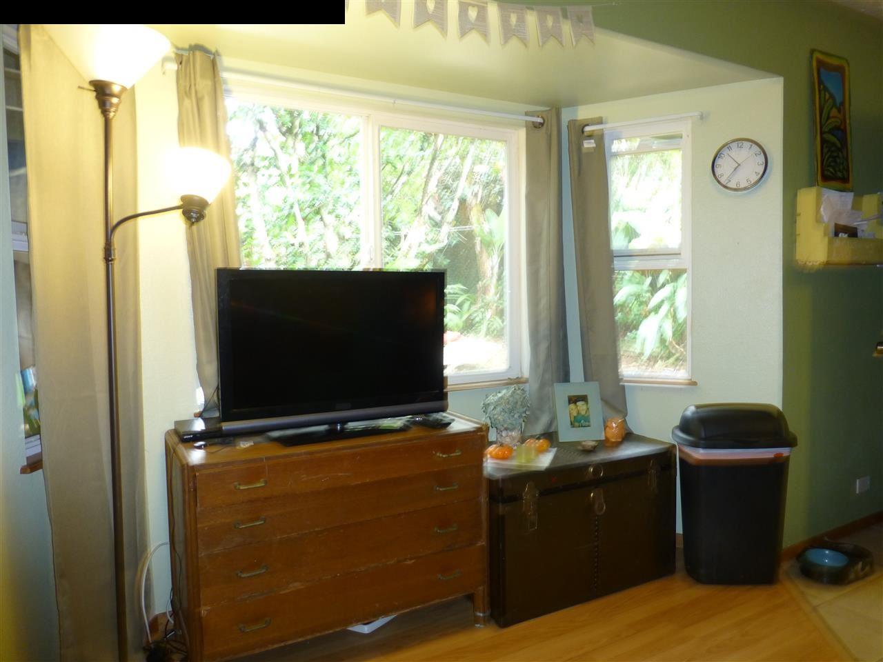 1765 Haiku Road Haiku, HI 96708 - Photo 8 of 25 a living room with furniture and a flat screen tv