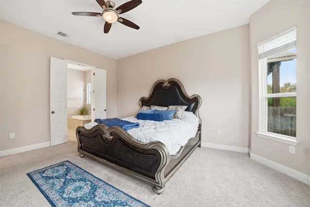 a view of a dining room with furniture large windows and wooden floor