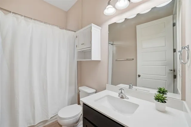 a bathroom with a tub a sink and shower