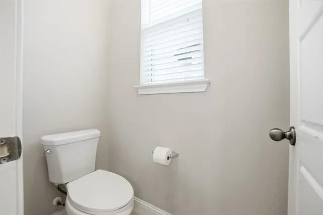 a bathroom with a tub shower and sink