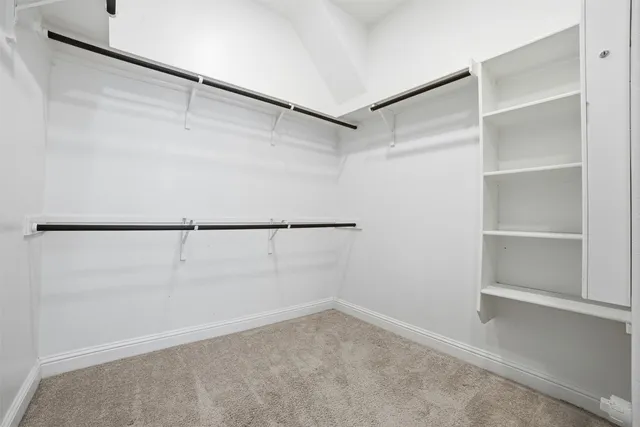 a bathroom with a sink vanity mirror and toilet