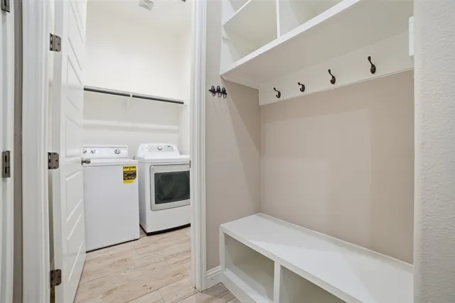 a white toilet sitting next to a window