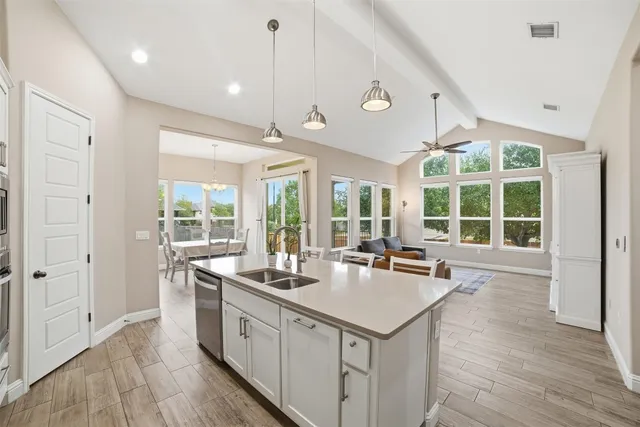an aerial view of residential houses with outdoor space