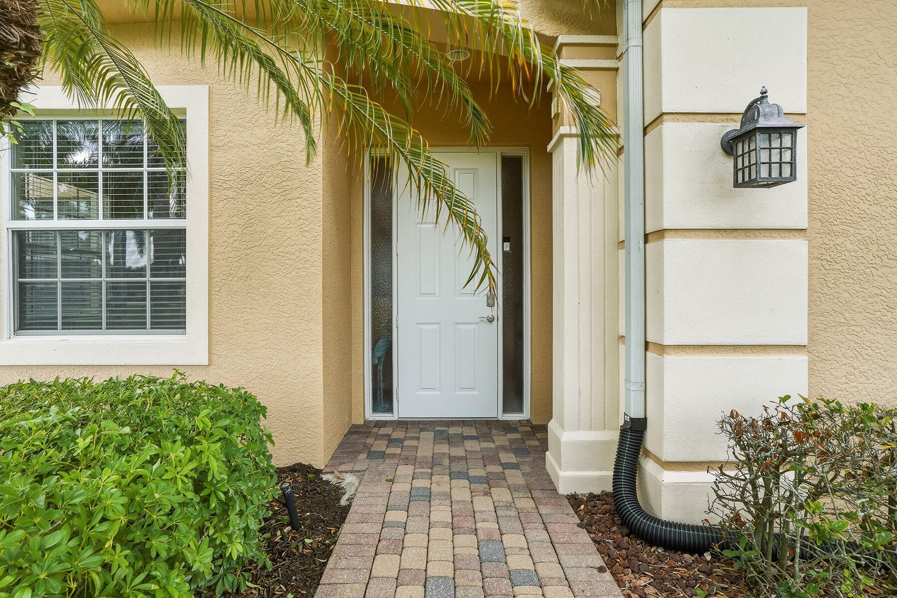 8605 Champions Point, Unit 103 Naples, FL 34113 - Photo 37 of 44 a front view of a house