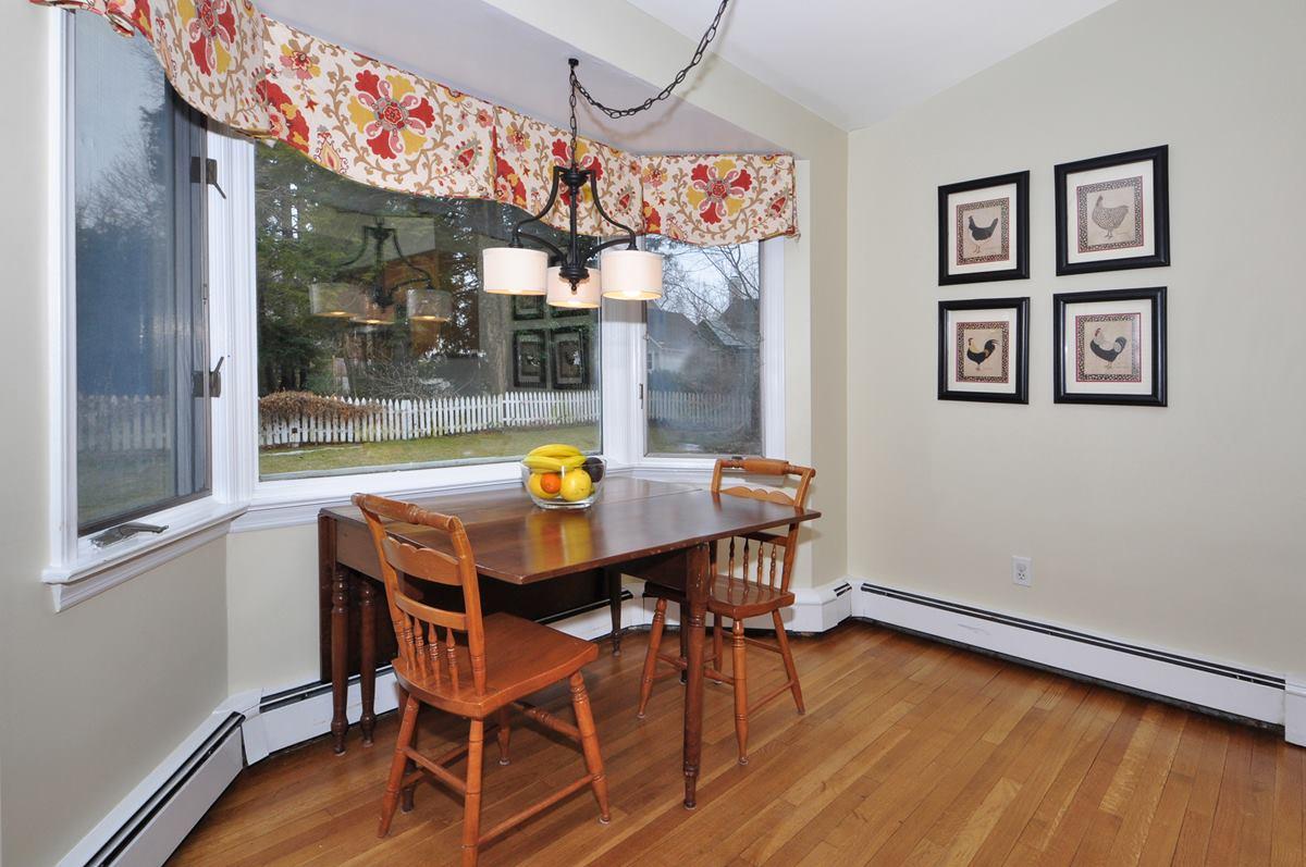 112 Hollow Tree Ridge Road Darien, CT 06820 - Photo 11 of 27 a view of a dining room with furniture window and wooden floor