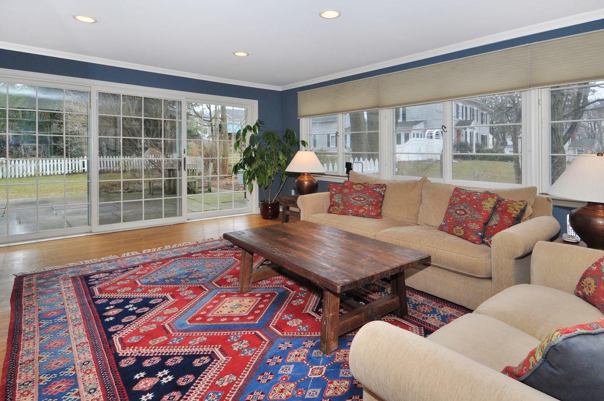 112 Hollow Tree Ridge Road Darien, CT 06820 - Photo 13 of 27 a living room with furniture and a table