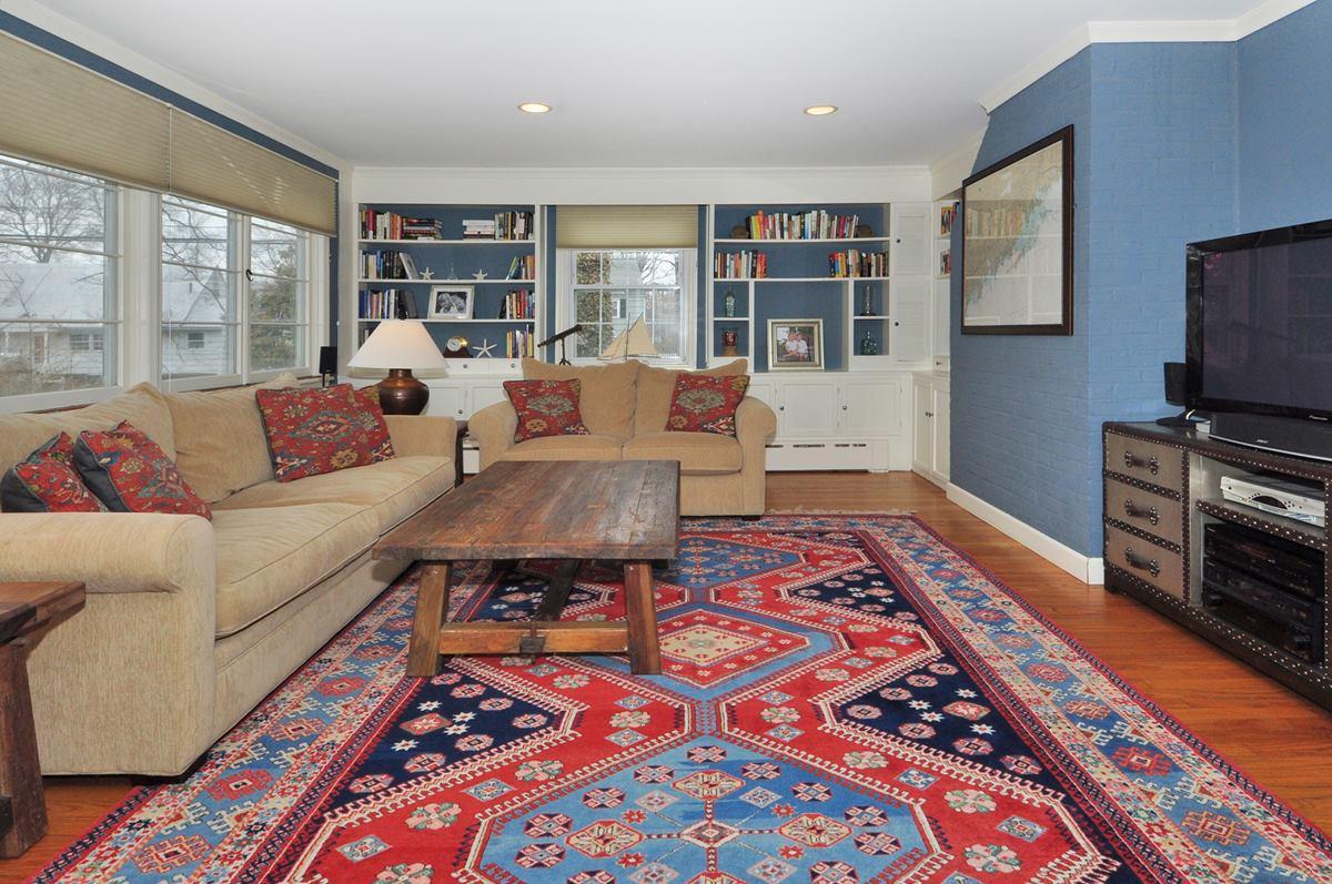 112 Hollow Tree Ridge Road Darien, CT 06820 - Photo 14 of 27 a living room with furniture and a rug