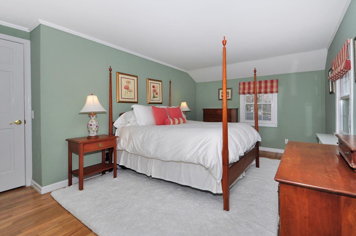 112 Hollow Tree Ridge Road Darien, CT 06820 - Photo 17 of 27 a bedroom with a bed and dresser