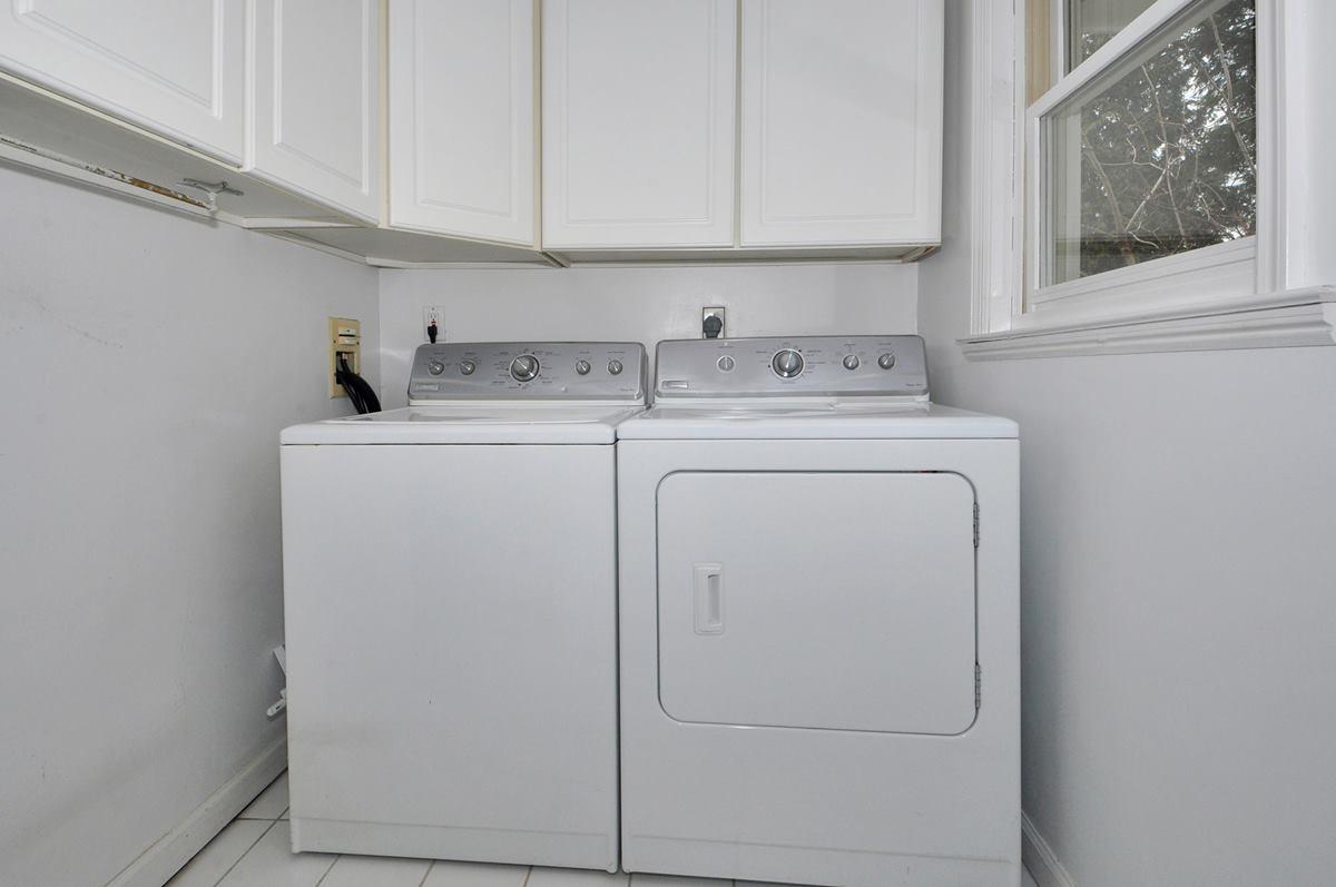 112 Hollow Tree Ridge Road Darien, CT 06820 - Photo 21 of 27 a utility room with dryer and washer