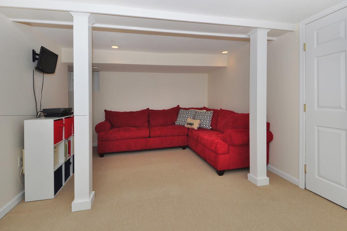 112 Hollow Tree Ridge Road Darien, CT 06820 - Photo 23 of 27 a living room with furniture and a ceiling fan