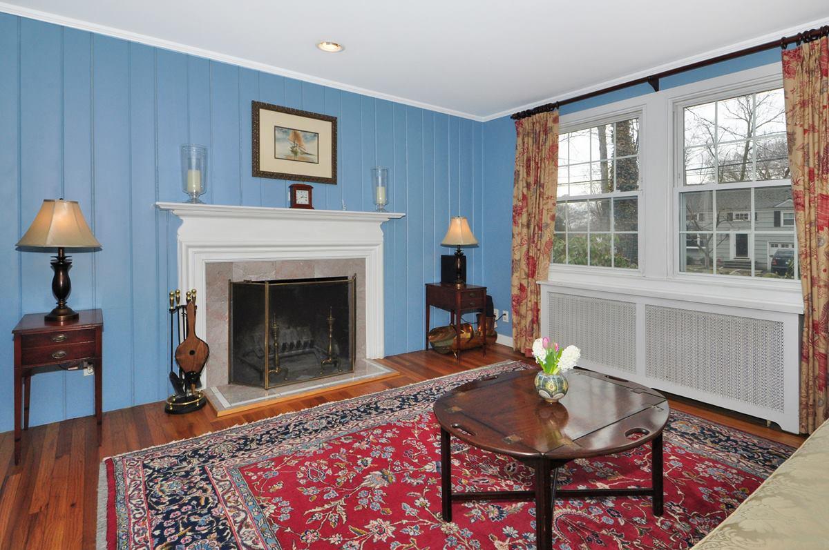 112 Hollow Tree Ridge Road Darien, CT 06820 - Photo 3 of 27 a living room with furniture and a fireplace