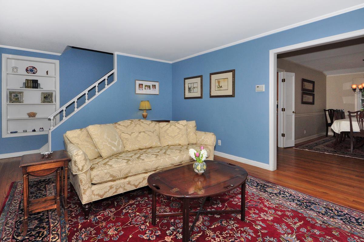 112 Hollow Tree Ridge Road Darien, CT 06820 - Photo 5 of 27 a living room with furniture and a rug