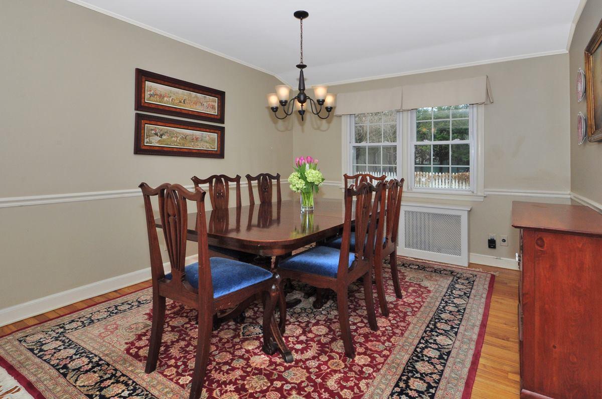 112 Hollow Tree Ridge Road Darien, CT 06820 - Photo 6 of 27 a view of a dining room with furniture window and wooden floor