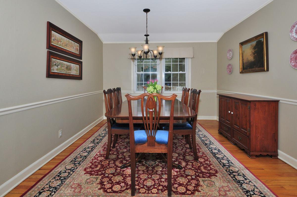 112 Hollow Tree Ridge Road Darien, CT 06820 - Photo 7 of 27 a dining room with furniture window and wooden floor