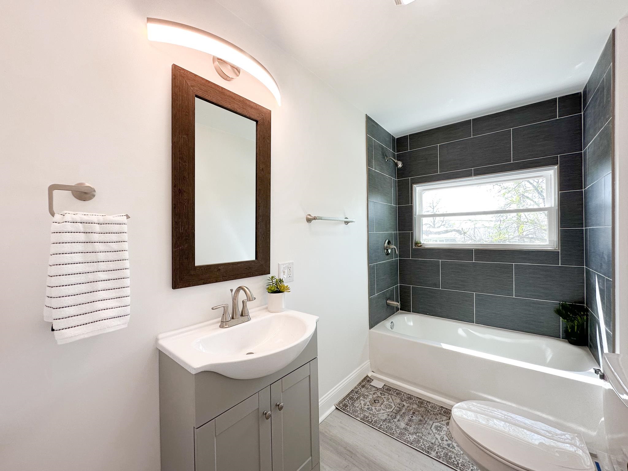 417 Cedar Green Road Staunton, VA 24401 - Photo 40 of 53 a bathroom with a tub sink and mirror