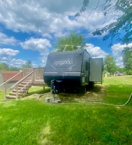 a view of house with backyard