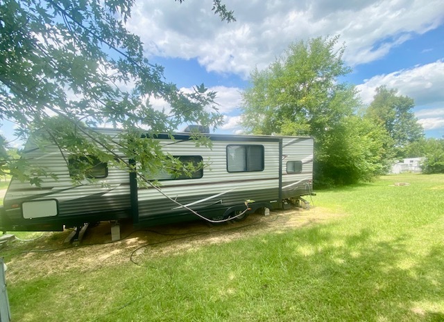 25-126 Woodhaven Sublette, IL 61367 - Photo 6 of 17 a front view of a house with a garden