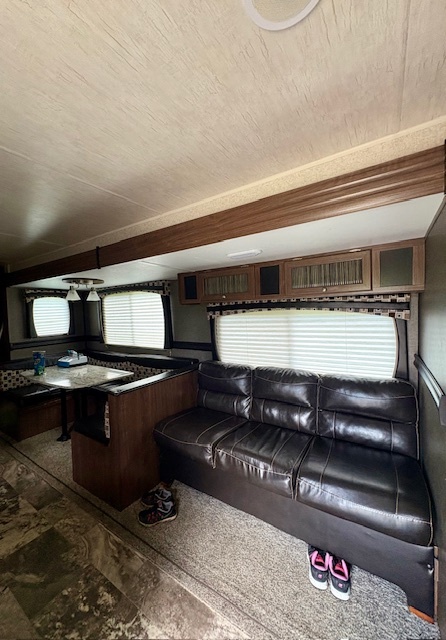 25-126 Woodhaven Sublette, IL 61367 - Photo 10 of 17 a living room with a couch and stove