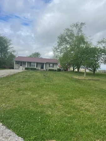 a view of a house with a big yard
