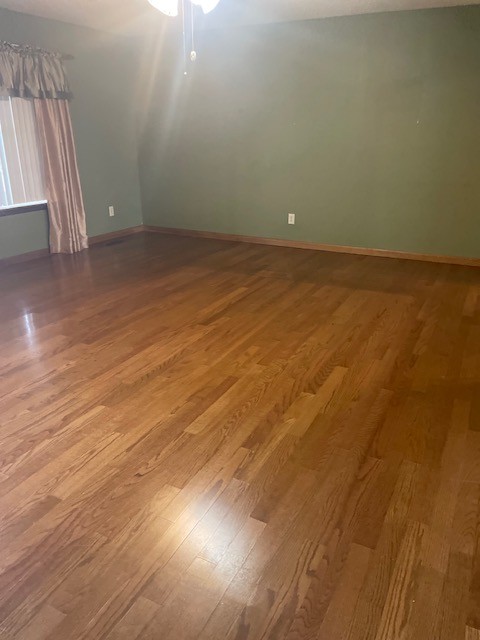108 Bud Taylor Road Ethridge, TN 38456 - Photo 18 of 28 an empty room with wooden floor and windows