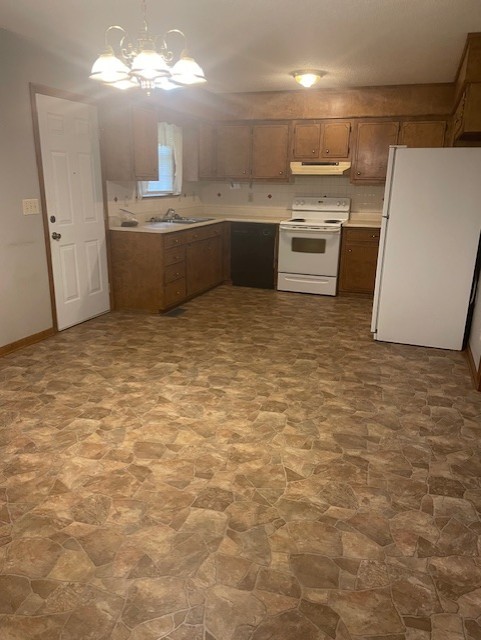 108 Bud Taylor Road Ethridge, TN 38456 - Photo 7 of 28 a room with kitchen island a sink a stove and cabinets