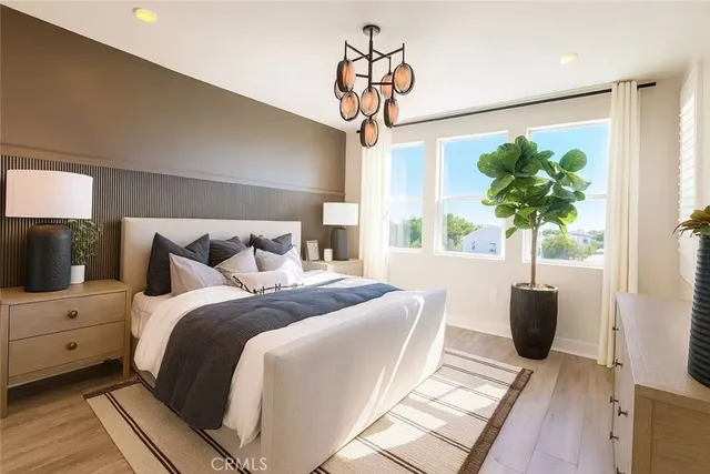 a bedroom with bed and a window