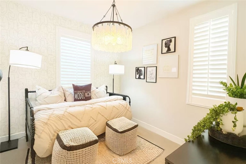 609 Gadwall Irvine, CA 92618 - Photo 8 of 10 a bedroom with a bed and a window
