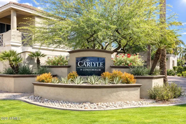 a view of outdoor space with a garden and signage