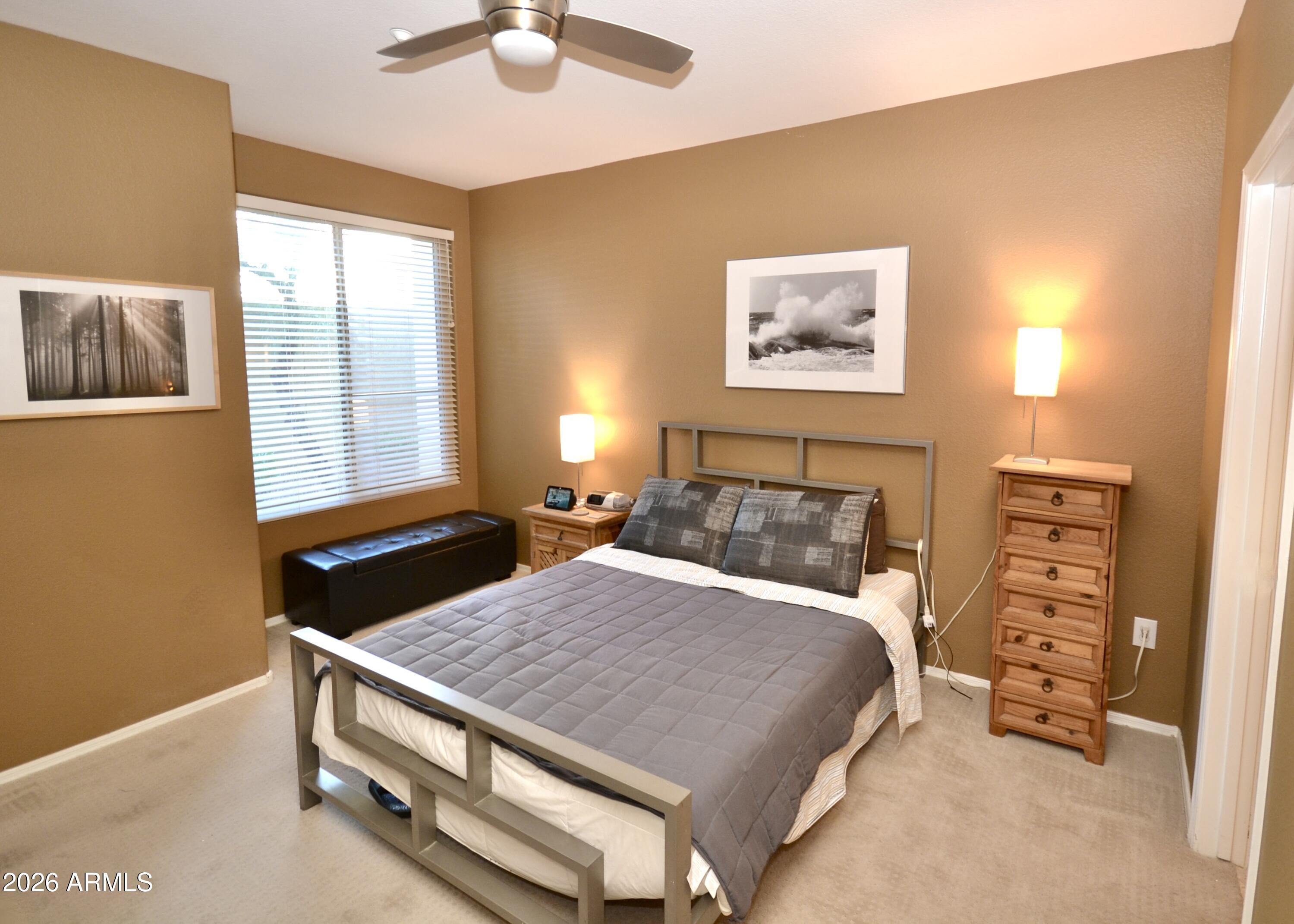 5303 North 7th Street, Unit 117 Phoenix, AZ 85014 - Photo 19 of 31 a bedroom with a bed and a window